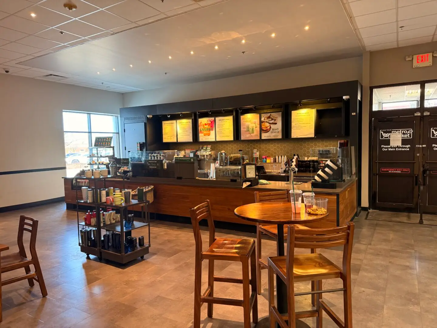 Commercial interior remodeling of a cafe space, featuring a Starbucks counter and seating.