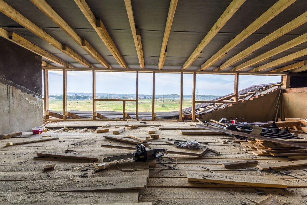 Unfinished construction interior and framing, view of property rebuild project with HammerCore Group.